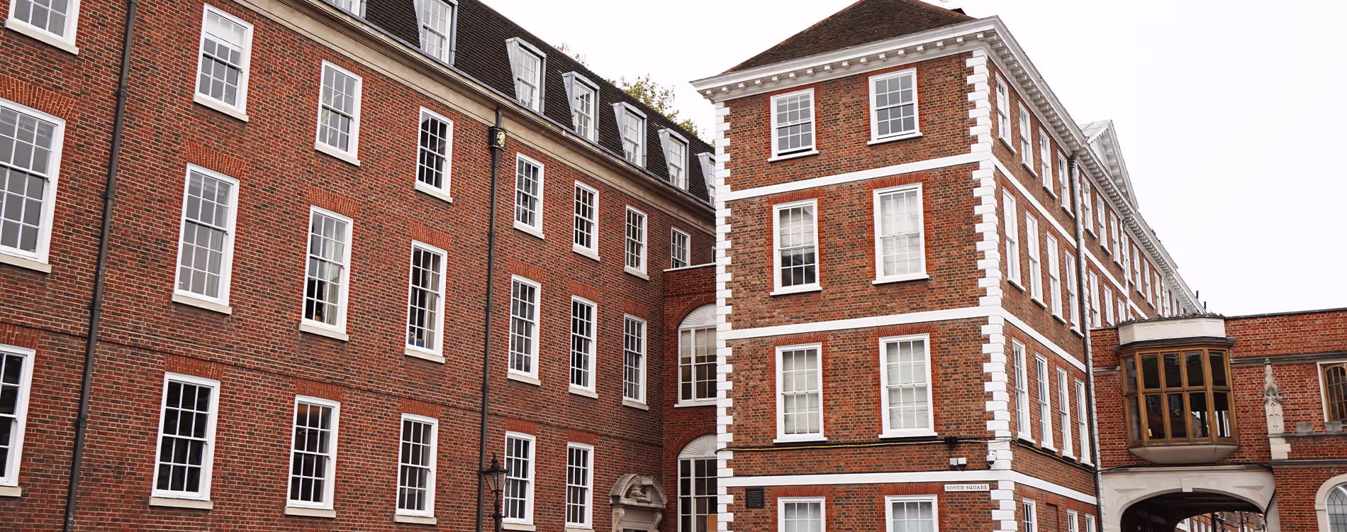 The impressive red brick exterior of a historic London building, the subject of a sensitive heritage modernisation project.