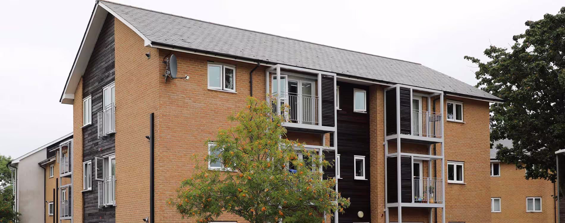Aerial view of modern housing development managed by Metropolitan Thames Valley Housing, representing large-scale residential construction projects.
