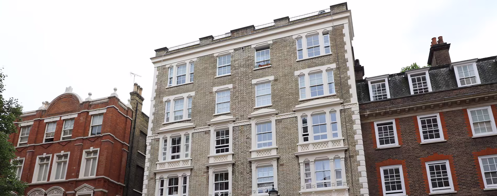 The facades of several historic London apartment buildings, showcasing the type of properties that undergo residential repairs and external maintenance.