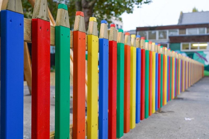 colourful pencil fence outside of a school